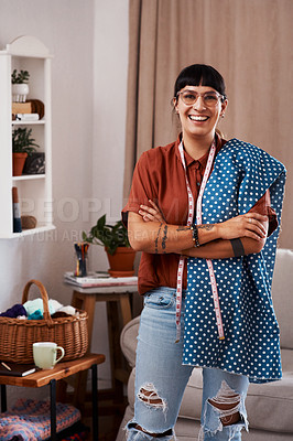 Buy stock photo Shot of a clothes maker posing with fabric at home