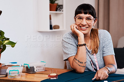 Buy stock photo Cropped shot of a young woman making a garment at home