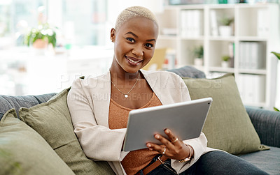 Buy stock photo Portrait of a young businesswoman using a digital tablet in an office