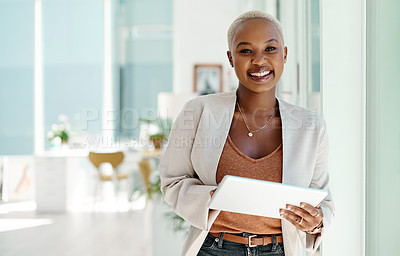 Buy stock photo Portrait of a young businesswoman using a digital tablet in an office