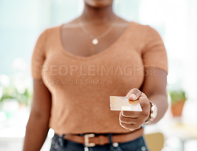 Buy stock photo Cropped shot of an unrecognizable businesswoman making a credit card payment inside her office
