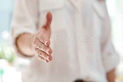 Buy stock photo Cropped shot of an unrecognizable businesswoman reaching out for a handshake inside her office