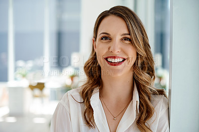 Buy stock photo Portrait of an attractive young businesswoman standing inside her office