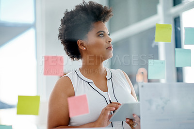 Buy stock photo Black woman, thinking or brainstorming on glass wall, tablet or sticky note for schedule planning in office. Solution, research or designer in startup for ideas, problem solving or creative project