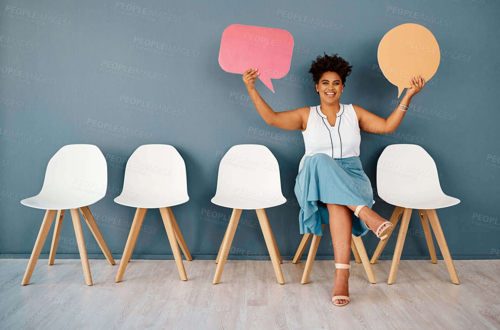 Buy stock photo Woman, waiting room with speech bubble and wall background, portrait and chairs for appointment. Hiring, feedback or recruitment in modern office workplace, communication and language translation