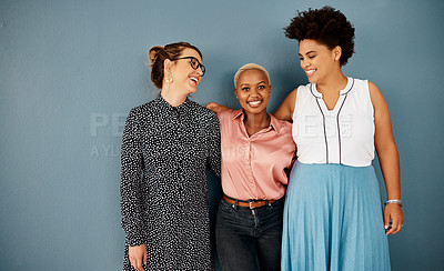 Buy stock photo Studio shot of a group of attractive young businesswomen smiling while standing together against a grey background