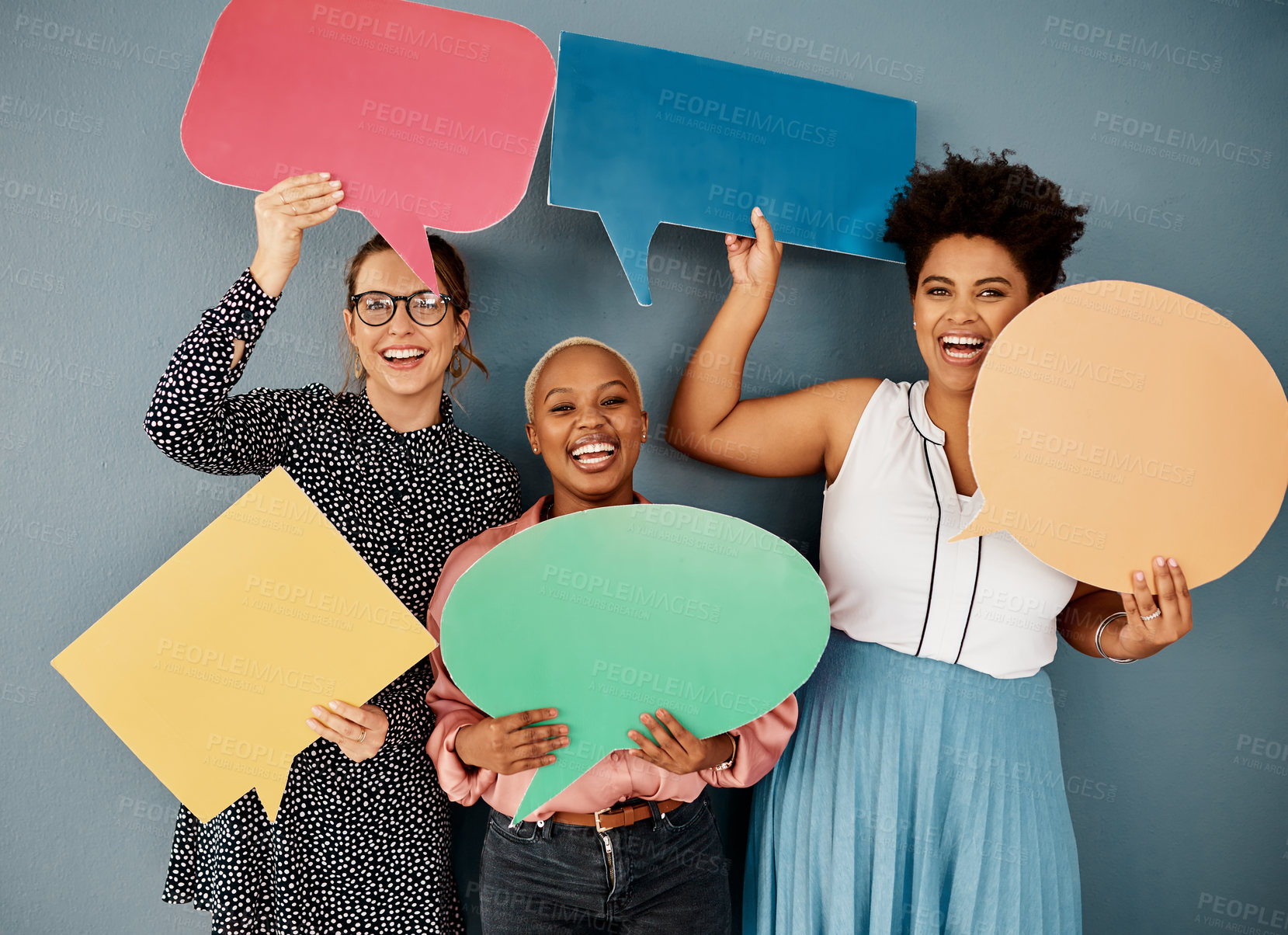 Buy stock photo Business team, portrait and speech bubble on wall background with networking, chat or communication. Creative woman quote, laughing and happy with poster mockup for language or translation in studio