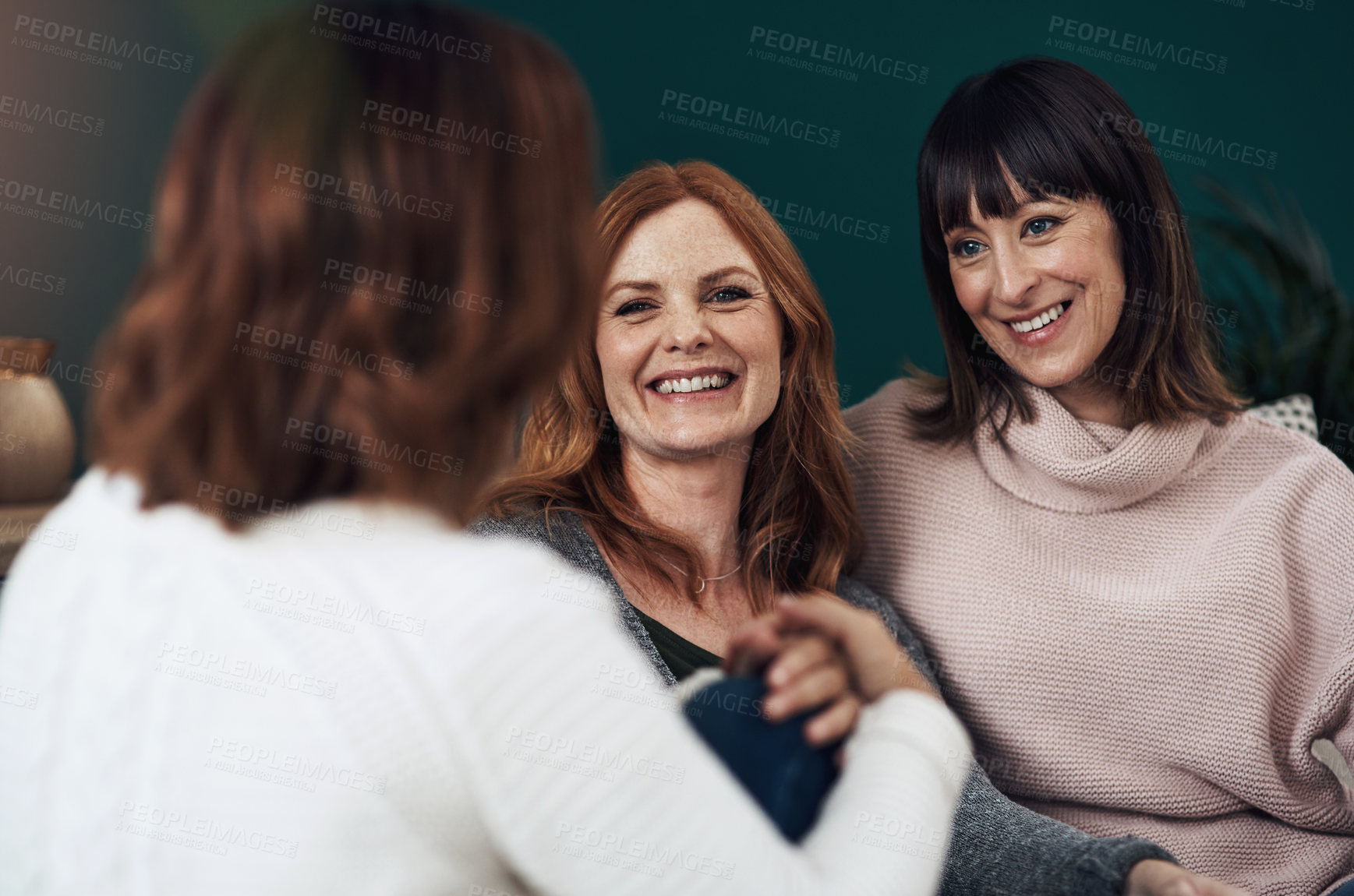 Buy stock photo Happy, women and friends on sofa for catch up, discussion and conversation about gossip and news. Excited, female people and smile for weekly bonding, family advice and group together at home