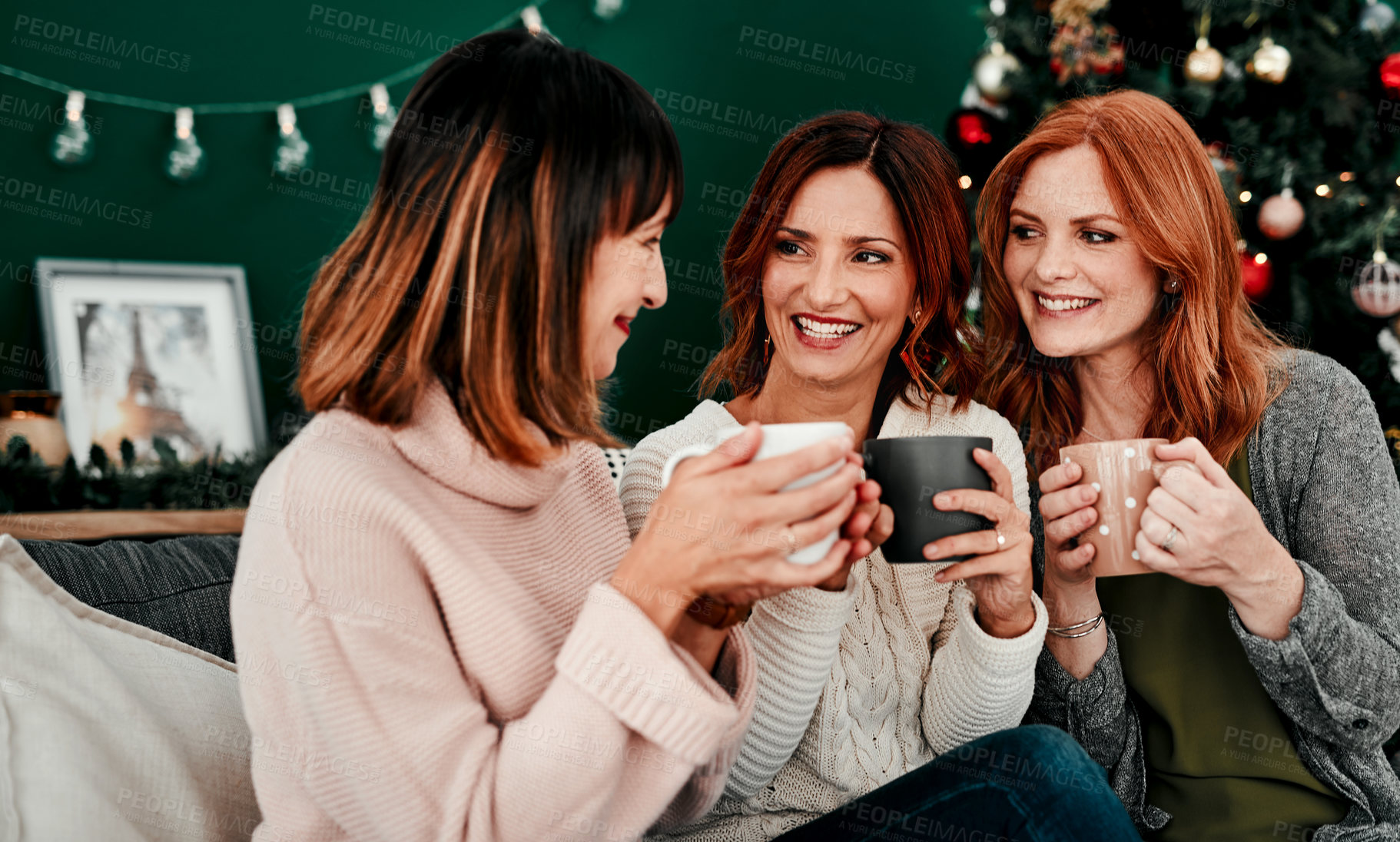 Buy stock photo Christmas, friends and women on sofa with cacao for relax, festive season or tradition in living room. Xmas tree, reunion and female people for December holiday, winter break or celebration in home