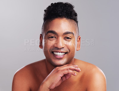Buy stock photo Portrait of a handsome young man posing against a grey background