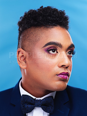 Buy stock photo Thinking, man and makeup in studio for fashion, pride and cosmetics on blue background. Gay male person, idea and sexuality with pride for rouge, lgbt community or transgender identity with style