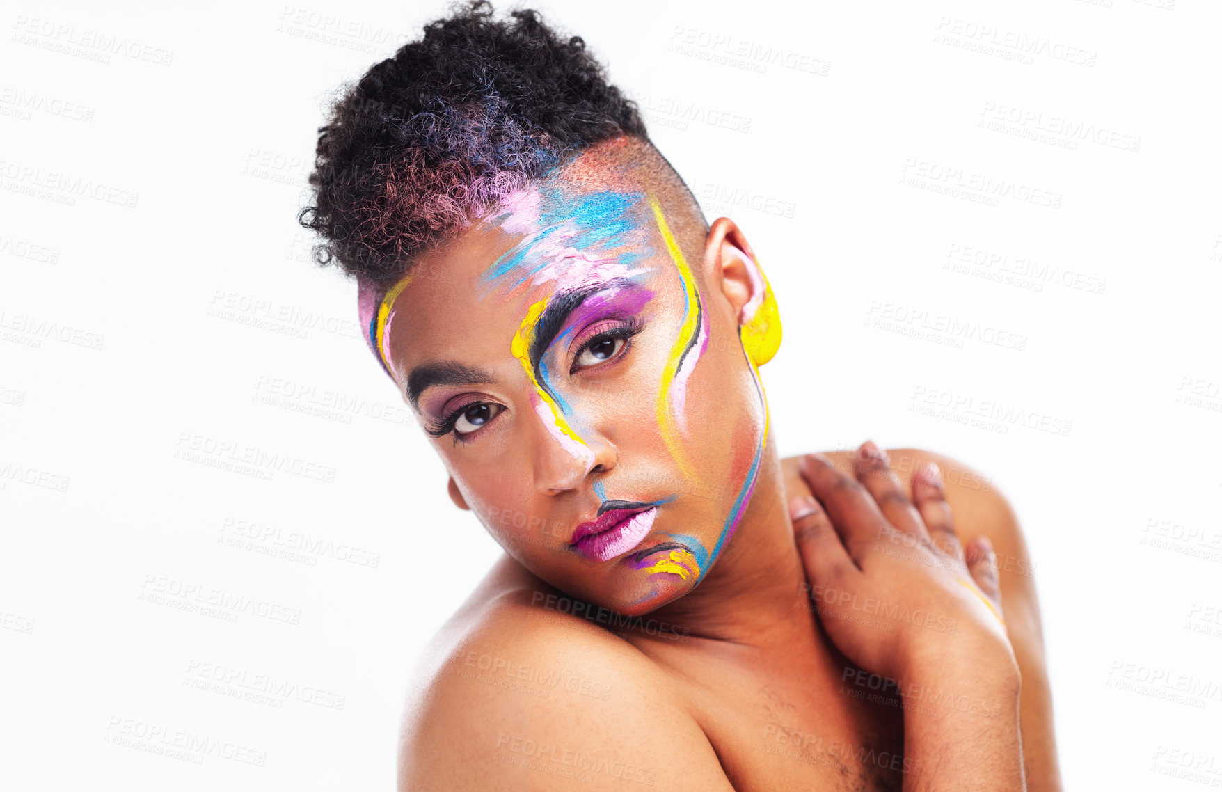 Buy stock photo Portrait of a gender fluid young man wearing face paint against a white background