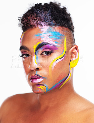 Buy stock photo Portrait of a gender fluid young man wearing face paint against a white background