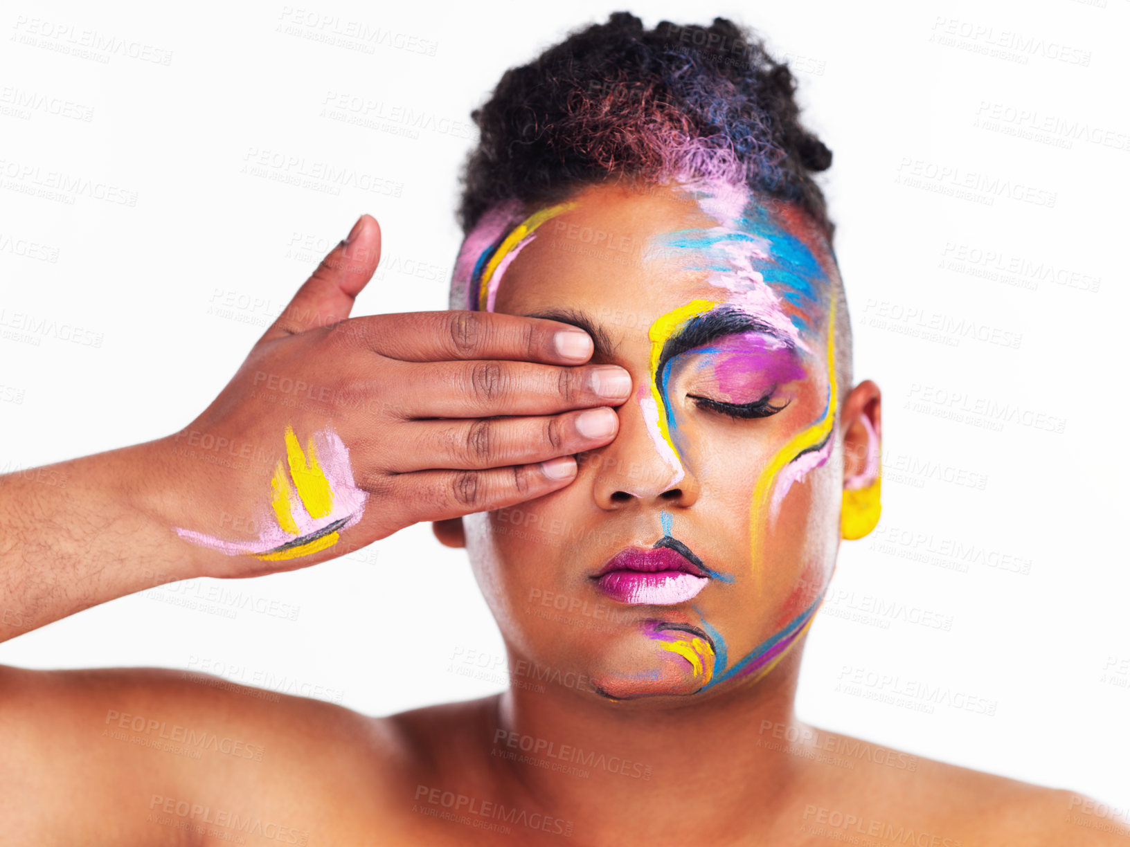 Buy stock photo Cropped shot of a gender fluid young man wearing face paint against a white background