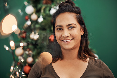 Buy stock photo Woman, portrait and cheerful with Christmas tree for festive, holiday and celebration with happiness in home. Female person, decoration and bokeh for season, smile and peace with excited for December