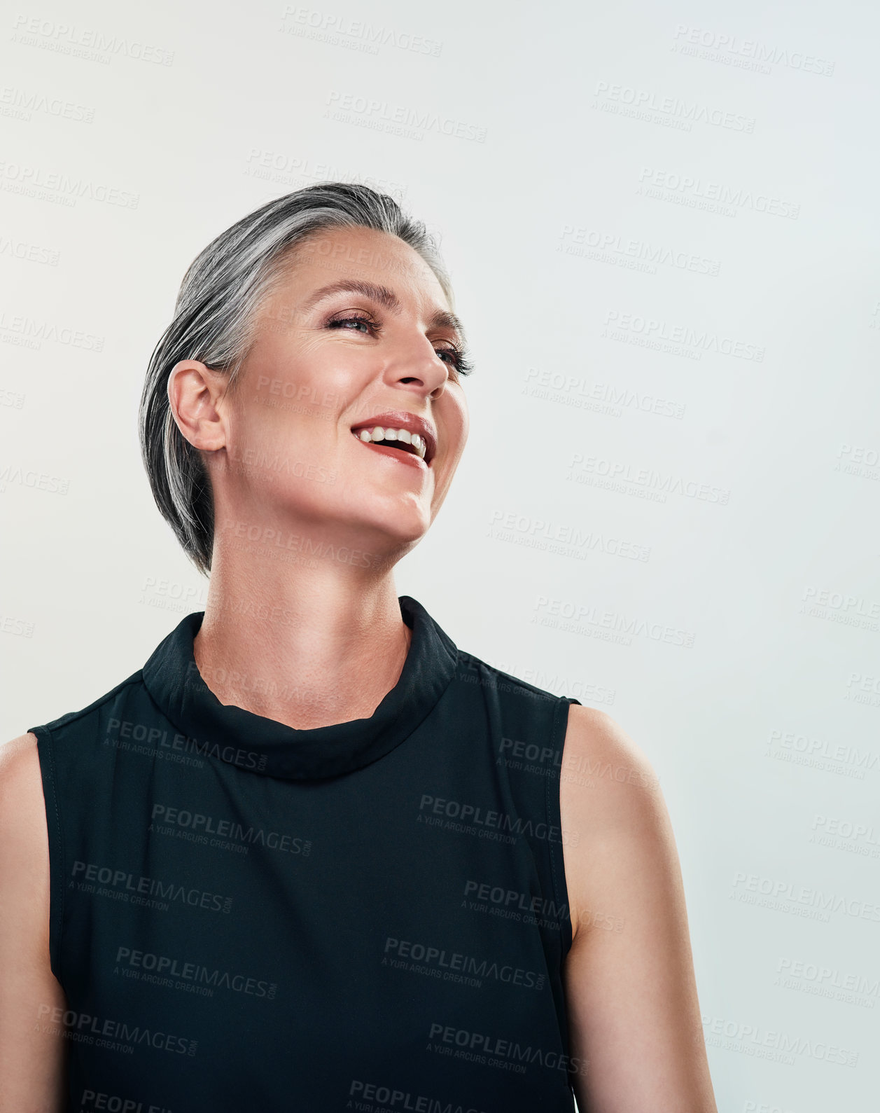 Buy stock photo Studio shot of a beautiful mature woman posing against a grey background