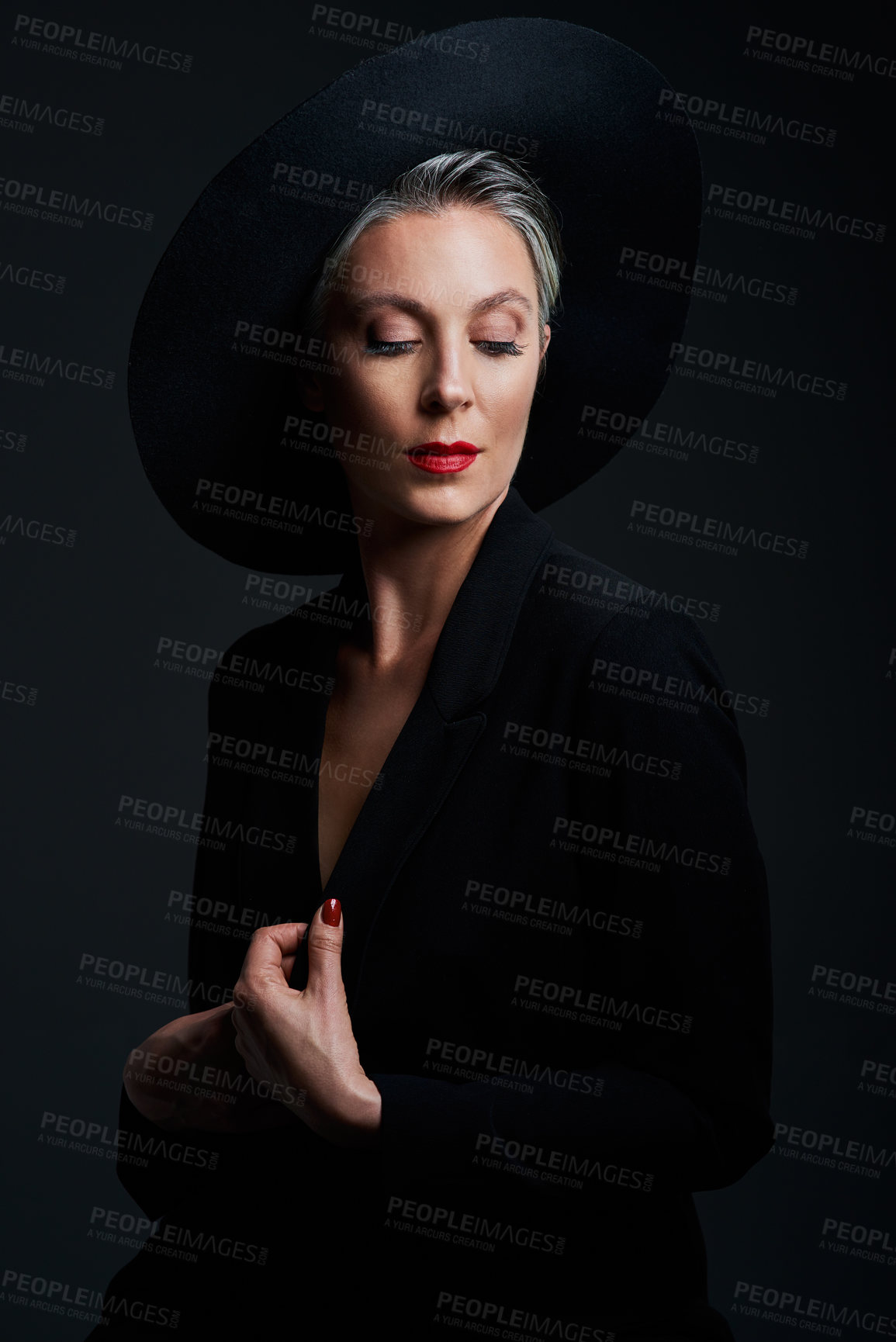 Buy stock photo Mature, woman and beauty with fashion in studio for aesthetic, glamour and luxury or lipstick. Hat, female person and style by black background for cosmetics, makeup and pride for age with glow