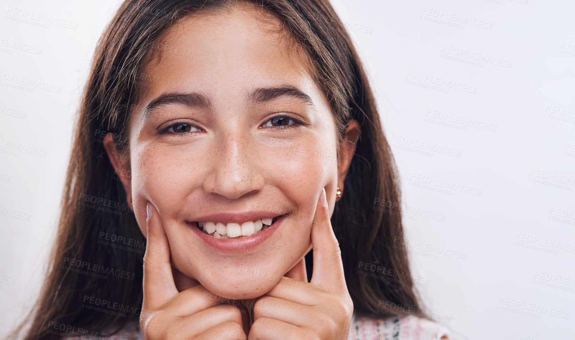 Buy stock photo Happy, fingers on cheek and portrait of girl in studio with smile, joy and cute expression. Youth, teenager and person with hands on face for silly, adorable and comic gesture on white background