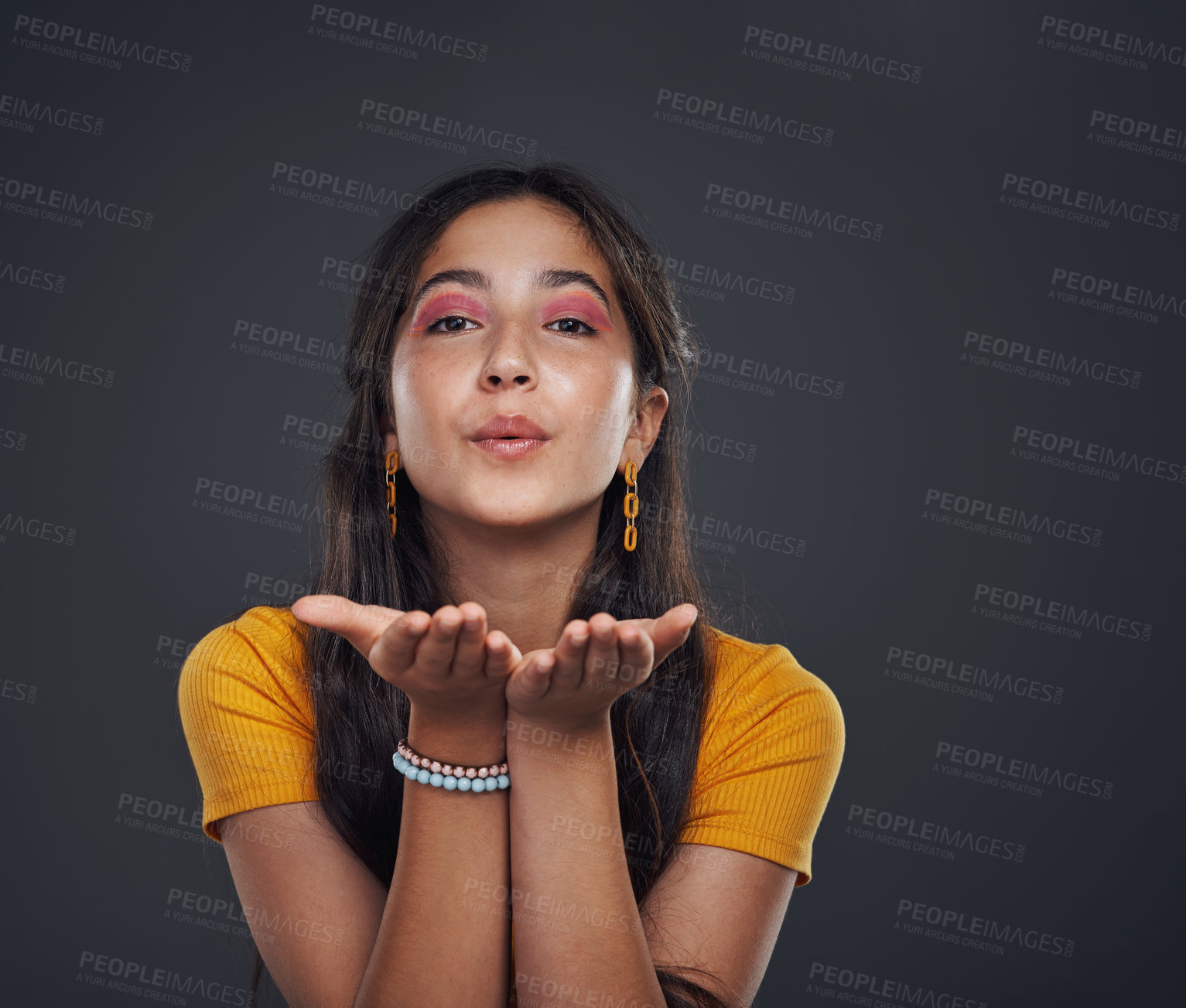 Buy stock photo Makeup, portrait and girl with air kiss sign, support and thank you gesture on dark background in studio. Creative, beauty and face of teenage model with hand, emoji or expression with cosmetics