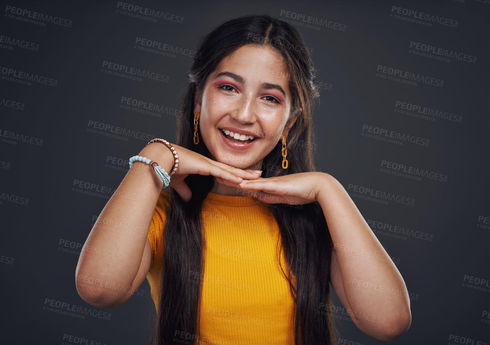 Buy stock photo Happy, portrait and girl with makeup in studio for facial, art and cosmetics, shine and artistic expression on black background. Smile, face and teenage model with dermatology, treatment and results