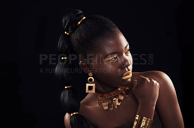 Buy stock photo Gold, beauty and black woman in studio for makeup, art and elegance against a black background. Rich, creative and African female model pose with jewelry for wealth, royal and luxury queen aesthetic