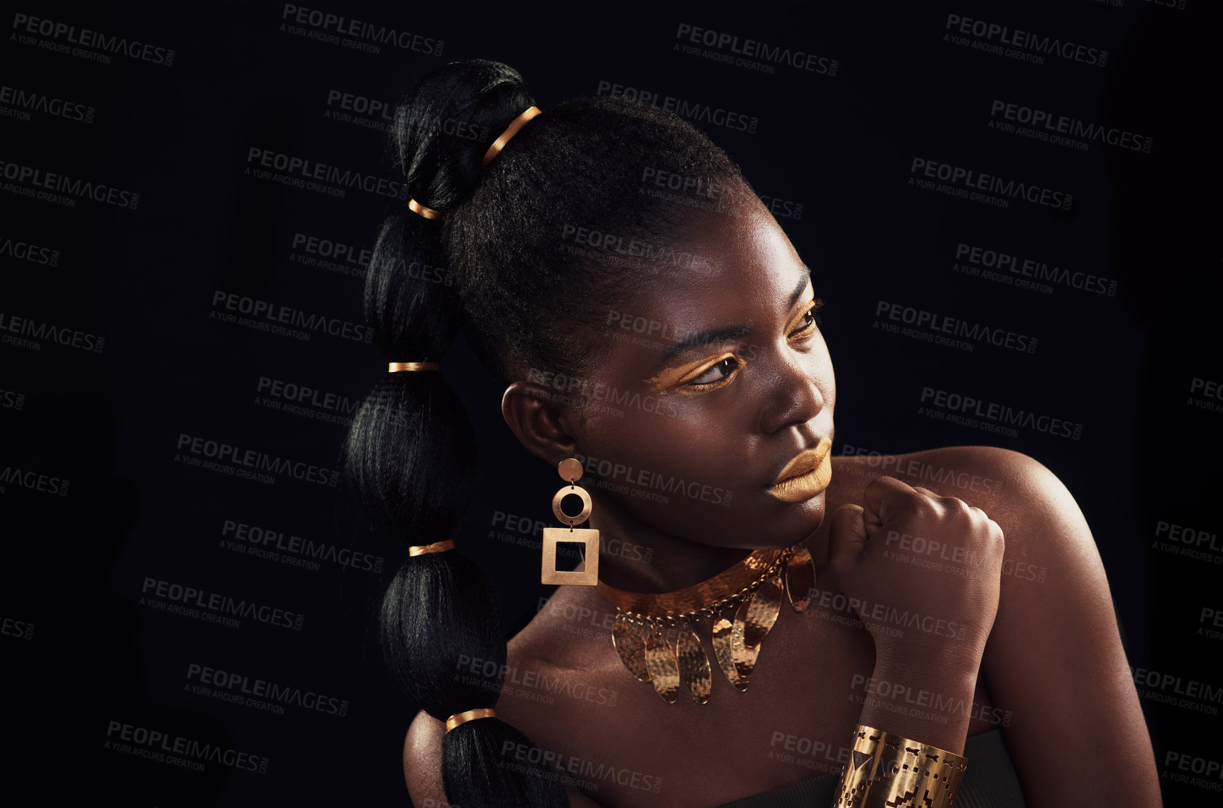 Buy stock photo Gold, beauty and black woman in studio for makeup, art and elegance against a black background. Rich, creative and African female model pose with jewelry for wealth, royal and luxury queen aesthetic