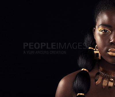 Buy stock photo Half, portrait and black woman in studio with gold, luxury and makeup on black background. Glitter, face and African female model with wealth, glow and jewellery, elegance and posing royal aesthetic
