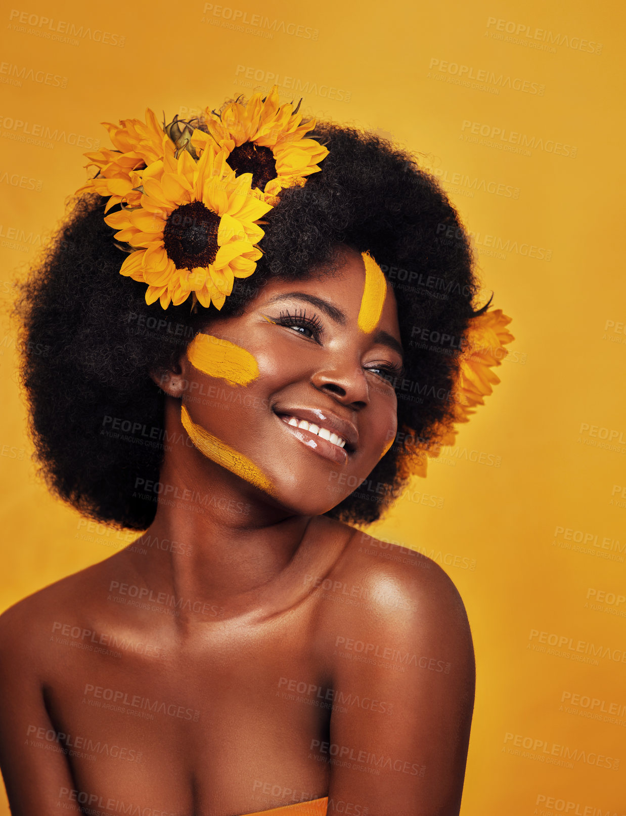 Buy stock photo Black woman, plant and sunflower with skincare in studio for organic glow, dermatology or soft skin. Person, floral and confident with smile for natural, cosmetics and vitamin e on yellow background