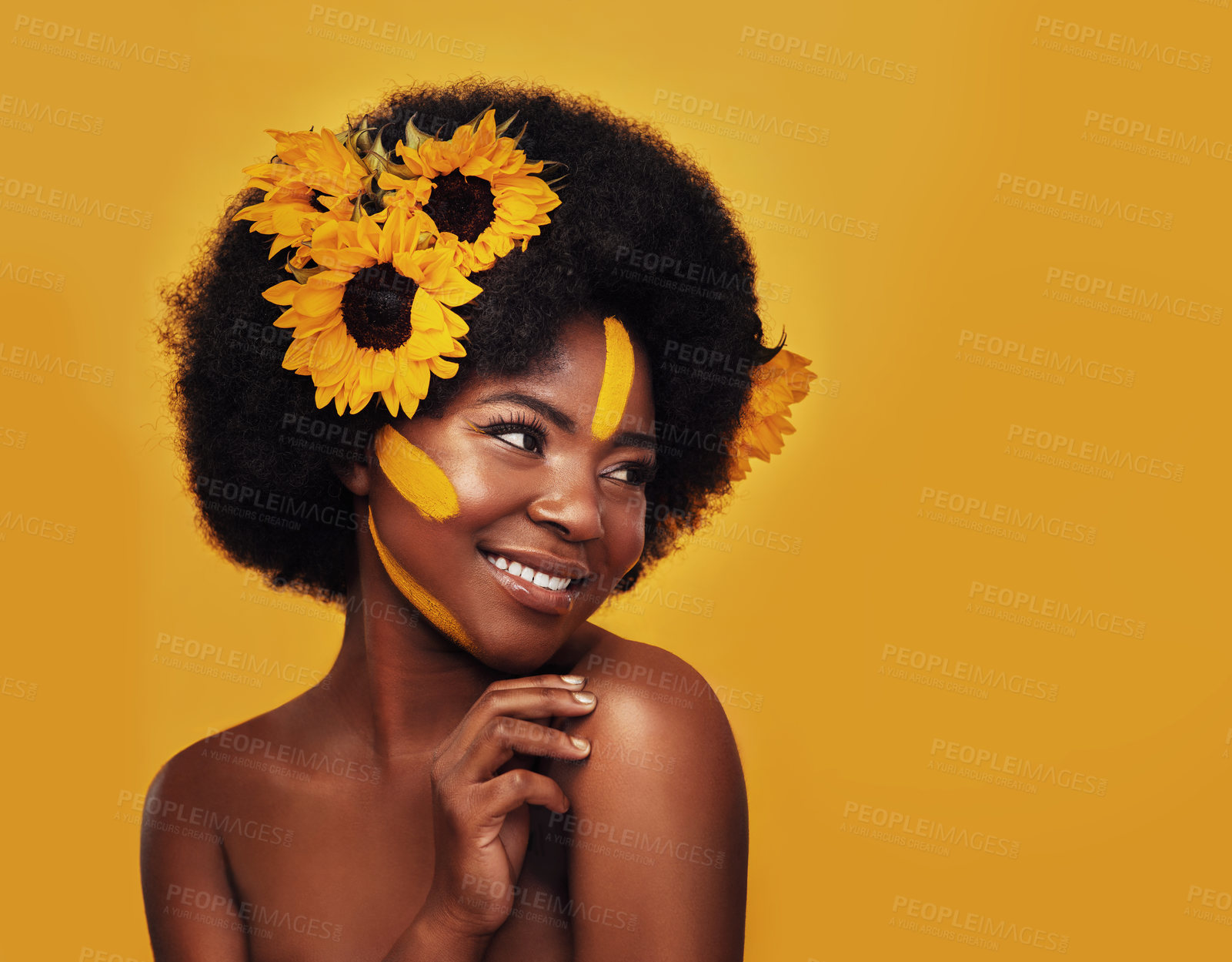 Buy stock photo Black person, smile and sunflower with skincare in studio for natural cosmetics, glow or soft skin. Woman, pose and confident with plant for organic, treatment and vitamin e on yellow background