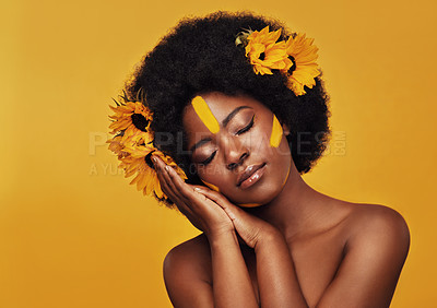 Buy stock photo Black woman, studio and natural sunflowers for spring, nature skincare and rest with African model and afro. Selfcare, wellness for beauty with organic cosmetics, dermatology on yellow background