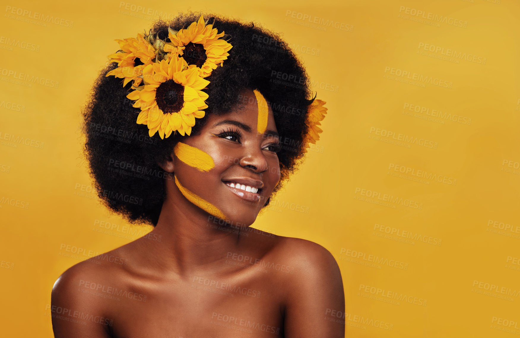 Buy stock photo Black person, happy and sunflower with skincare in studio for organic glow, dermatology or soft skin. Woman, confident and floral with plant for organic, cosmetics and vitamin e on yellow background