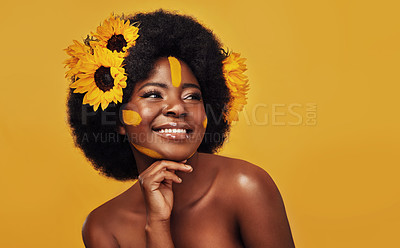 Buy stock photo Black person, studio and sunflower for skincare with glow, natural cosmetics and soft skin. Floral, woman and pose with smile for organic, dermatology and vitamin e treatment on yellow background
