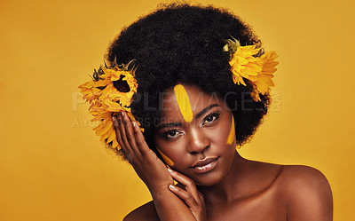 Buy stock photo Makeup, sunflower and art with portrait of black woman in studio for beauty, creative or spring. Natural, cosmetic and floral with face of model on yellow background for glow, self love or confidence