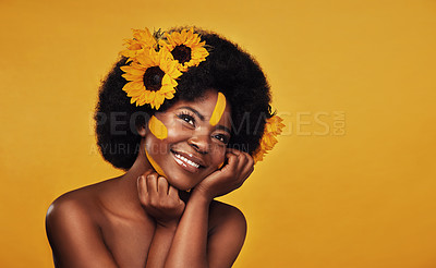 Buy stock photo Hair, sunflower and black woman with natural beauty in studio thinking, happy and relax on yellow background. Flower, haircare and African female model smile while contemplating cosmetic or treatment