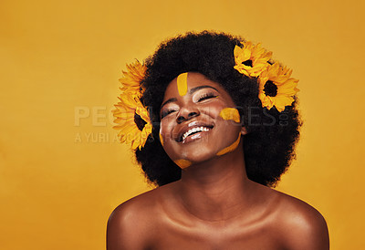 Buy stock photo Black woman, studio and natural sunflowers for spring, nature skincare and rest with African model and afro. Selfcare, wellness for beauty with organic cosmetics, dermatology on yellow background