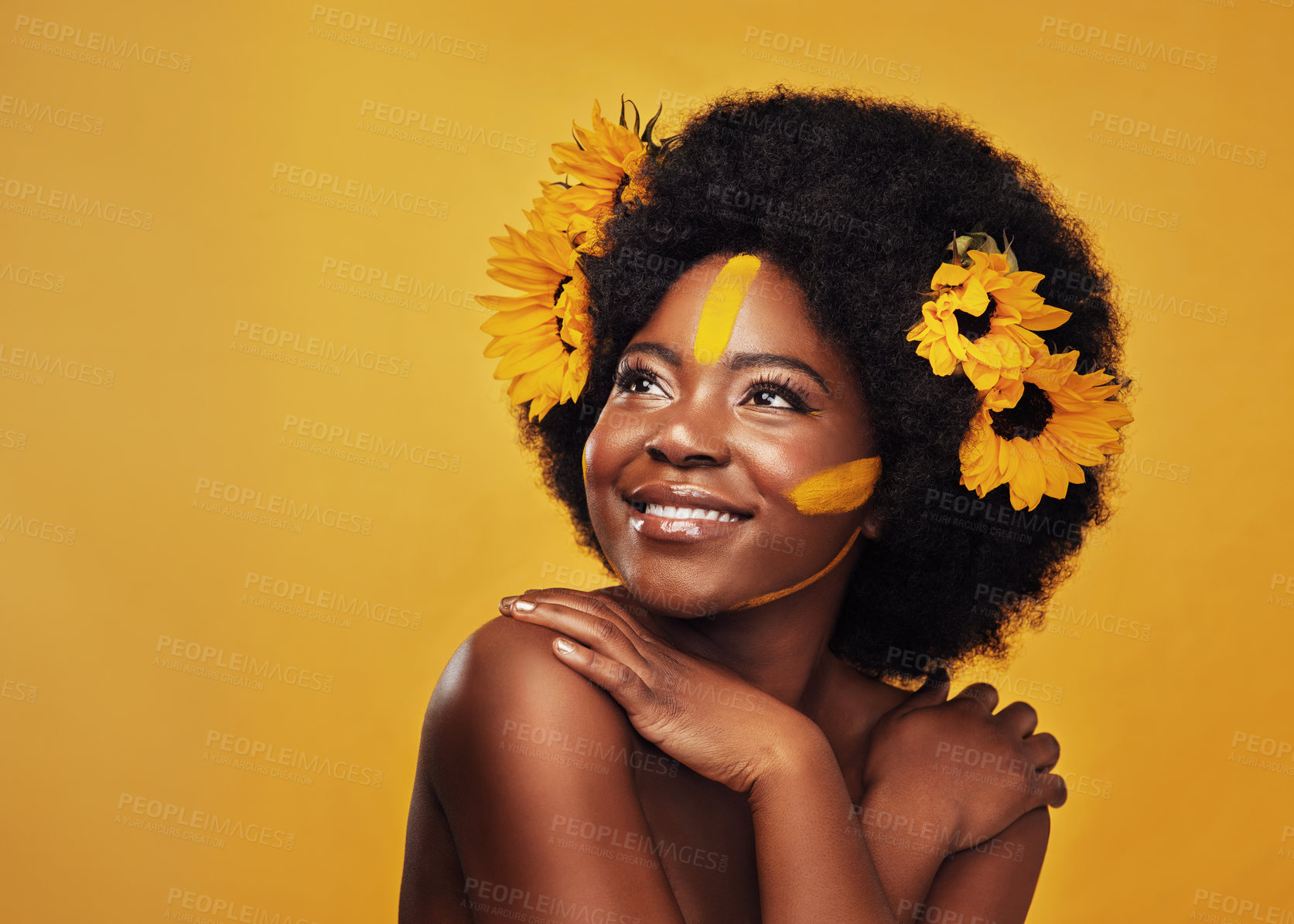 Buy stock photo Woman, studio and thinking with hands and sunflowers for idea, planning or vision with afro. African female and thought on mustard backdrop with makeup, natural beauty or skincare with sustainability