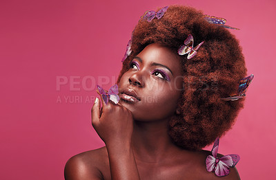 Buy stock photo Cosmetic, makeup and black woman with butterflies in a studio with beauty, natural and elegant face. Cosmetics, fantasy and young African female model posing with beautiful insects by pink background