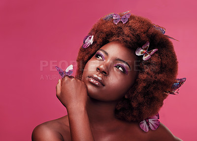 Buy stock photo Beauty, makeup and woman with butterflies in a studio  with a cosmetic, natural and elegant face. Cosmetics, fantasy and young African female model posing with beautiful insects by a pink background.