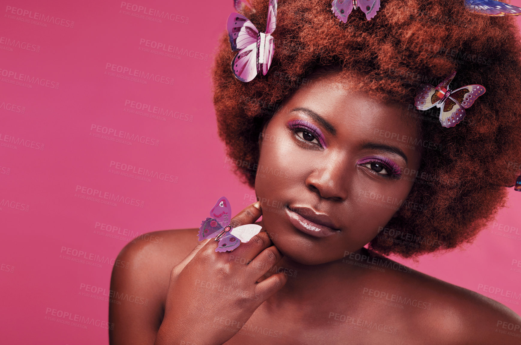 Buy stock photo Portrait, makeup and black woman with butterflies in studio with creative, art and fantasy. Cosmetics, beauty and female model from Nigeria with insects for facial cosmetology by pink background.
