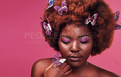 Buy stock photo Beauty, face and black woman with butterflies in studio with creative, art and fairy fantasy. Cosmetics, makeup and female model from Nigeria with insects for facial cosmetology by pink background.