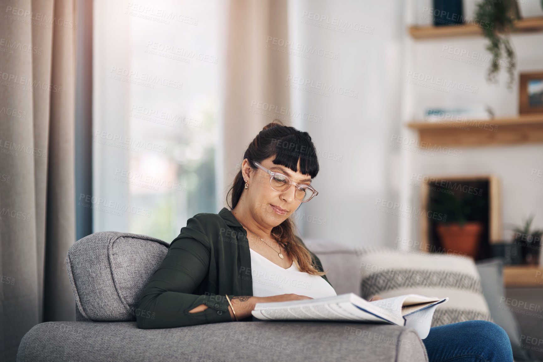 Buy stock photo Home, relax and woman with book on sofa for literature, information and growth in knowledge on weekend. House, glasses and female person with paper for education, learning and reading history story