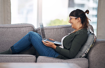 Buy stock photo Woman, laptop and happy to relax on couch for streaming, movie and subscription on web in home living room. Person, smile and computer on sofa for film, series or excited for funny comedy in Mexico