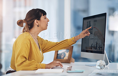 Buy stock photo Cropped shot of an attractive young businesswoman sitting alone in her office and using her computer