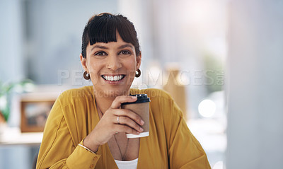 Buy stock photo Cropped portrait of an attractive young businesswoman sitting alone in her office and holding a cup of coffee