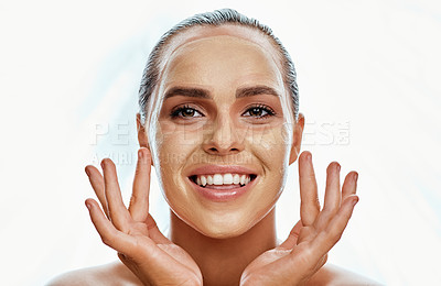 Buy stock photo Shot of a beautiful young woman wearing a face mask  against a white background