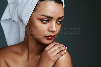 Buy stock photo Cropped shot of a beautiful young woman posing with a towel on her head