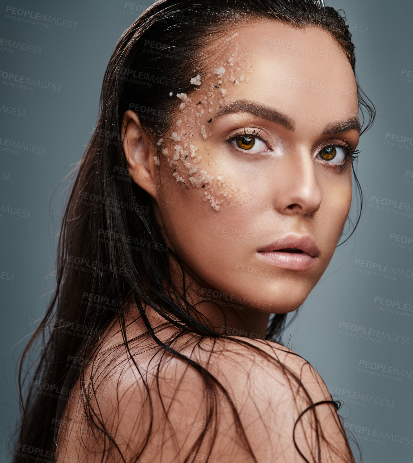 Buy stock photo Beauty, salt and portrait of woman in studio for wellness, health and natural facial treatment. Dermatology, spa and person for organic skincare, mineral exfoliation and cosmetics on gray background