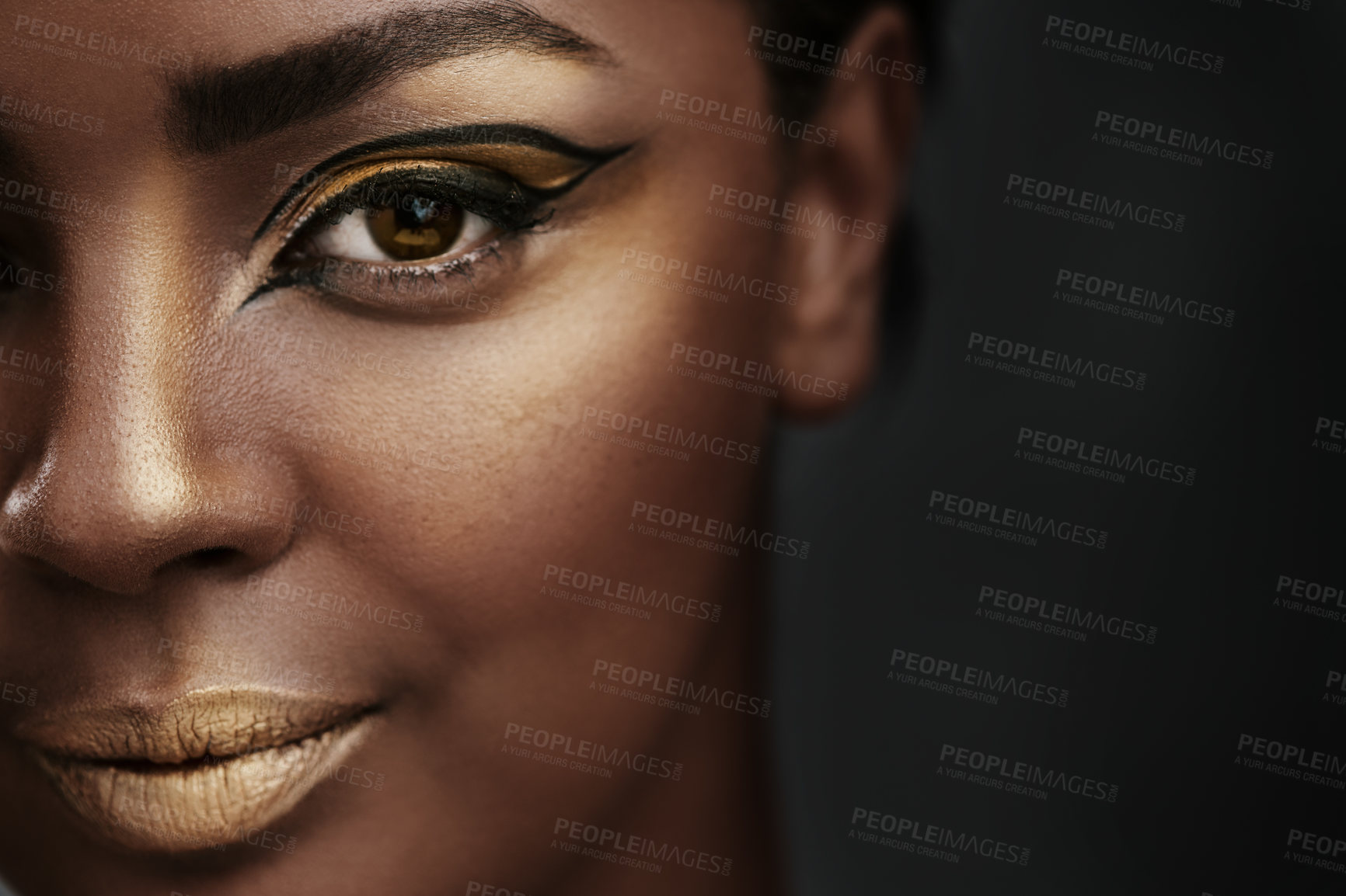 Buy stock photo Cat eye, makeup or portrait of woman with beauty, creative art or gold eyeshadow on half face. African model, facial cosmetic or eyeliner for skin glow or confident on black studio background closeup