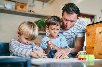 Buy stock photo Baking, home and father with children in kitchen with ingredients for learning, bonding and recipe. Happy, family and dad with young boys with flour to bake cookies, biscuits and treats together