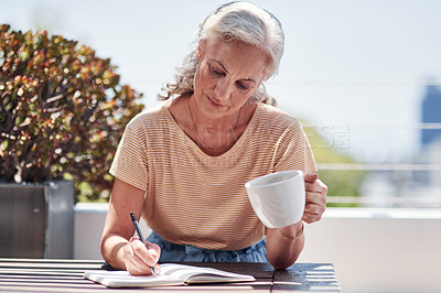 Buy stock photo Writing, book and an old woman author sitting outdoor in summer for inspiration as a writer. Idea, planning and a senior female pensioner drinking coffee while using a pen to write in her diary